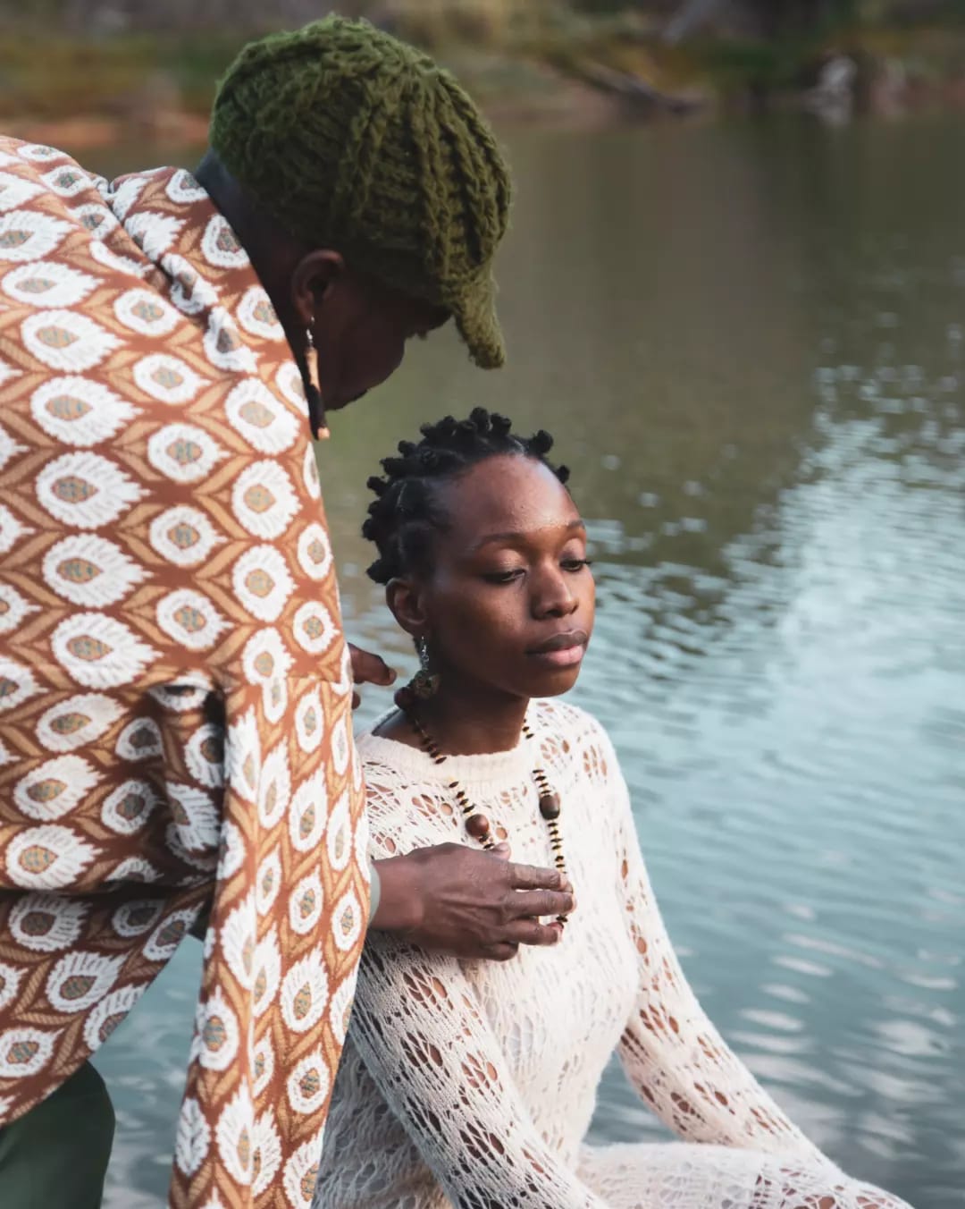 Ande Mafenuka styling — BALANCE editorial, two figures in African-print and crochet by water
