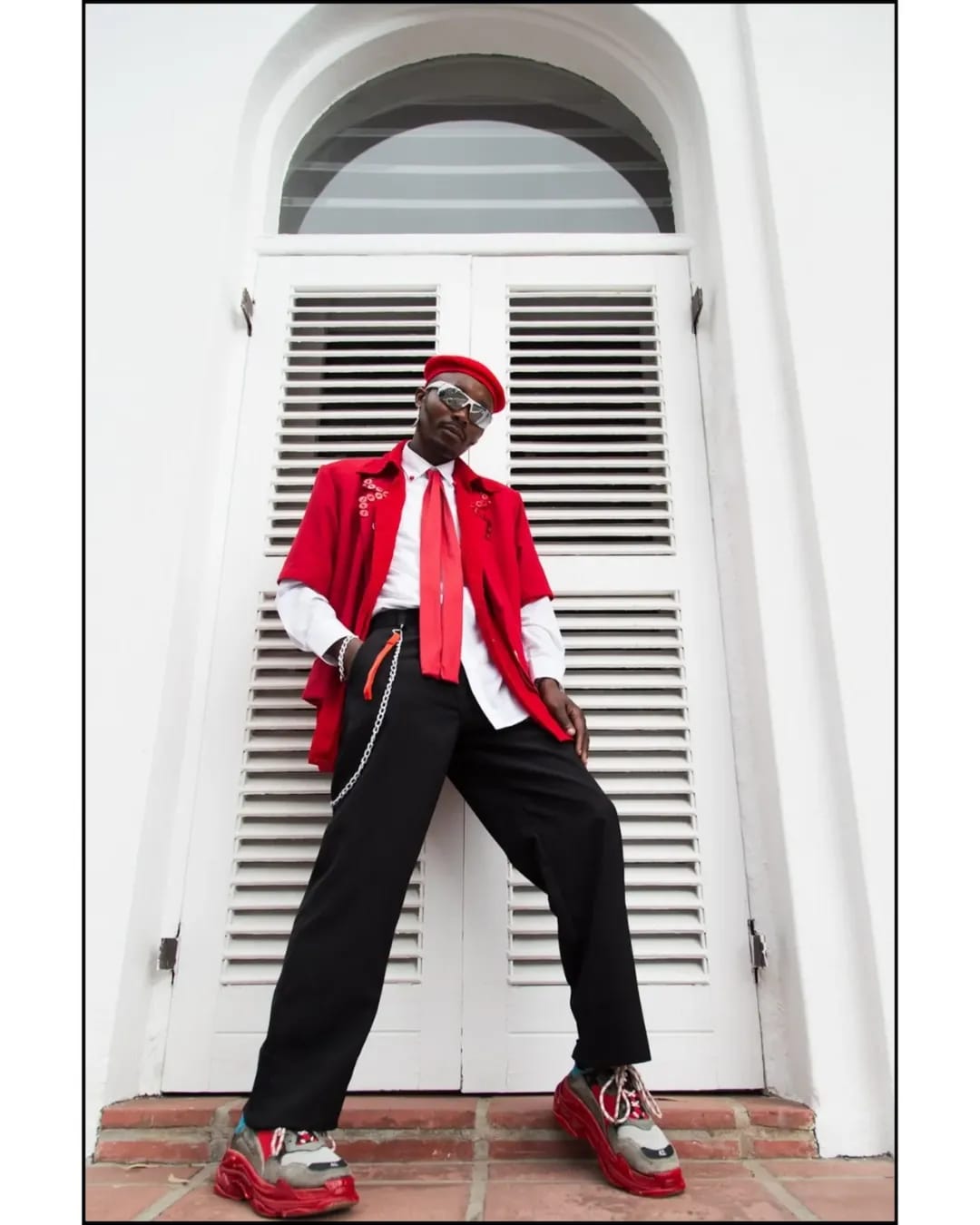 Ande Mafenuka styling — RETRO, red beret and tailoring against white shutters