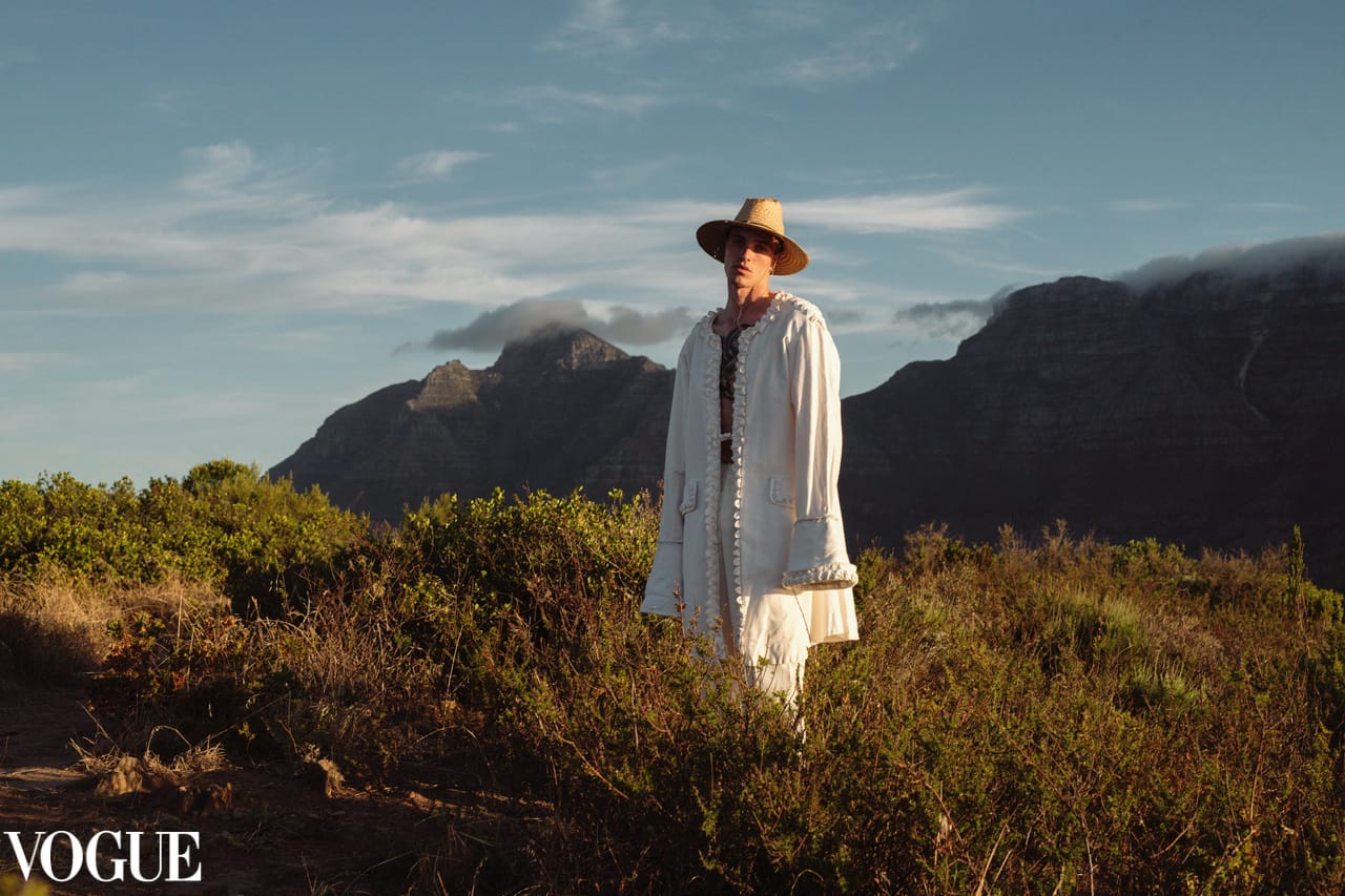 Ande Mafenuka wardrobe styling — Vogue editorial, white embroidered coat at Signal Hill, Cape Town